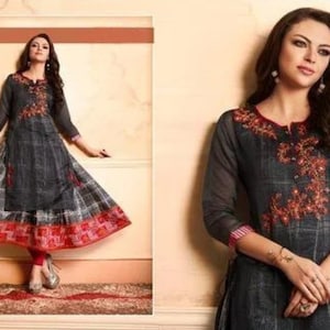 May include: A gray and black long-sleeved dress with red and white embroidery. The dress has a flared skirt and a round neckline.