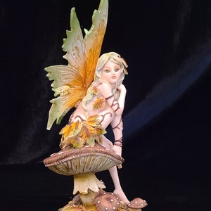 Fairy Figurine Sitting on Mushroom