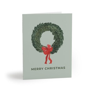 Merry Christmas Card with Wreath | Holiday Greeting Card with Red Bow | Festive Reindeer & Penguin Pattern Back | Blank Inside