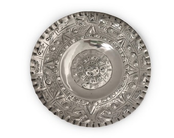 Placa decorativa de pared vintage con rostro de sol azteca, de metal plateado.