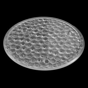 May include: A clear, round, textured glass lens with a raised pattern of small circles.