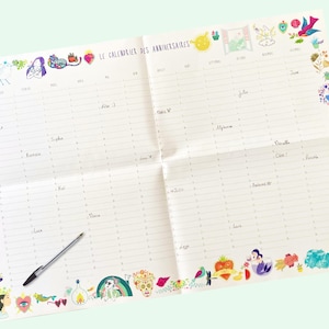 May include: A white calendar with a colorful border of illustrations. The calendar is titled "Le Calendrier des Anniversaires" and has spaces for each month of the year.