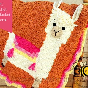May include: A crochet baby blanket with a C2C pattern featuring a white llama with a brown face and pink, yellow, and white stripes. The blanket has a scalloped edge with a pink, yellow, and white border. The text "C2C Crochet baby blanket pattern" is visible in the image.