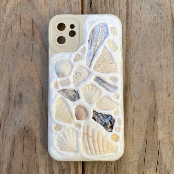 Handcrafted Memor inspired iPhone Case. Each case is unique. Made with hand picked Sanibel shells and authentic crystals.