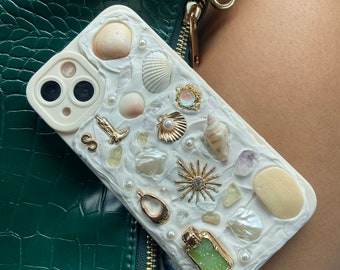 Handcrafted Memor inspired iPhone Case. Each case is unique. Made with hand picked Sanibel shells, authentic crystals, and charms.