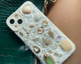 Handcrafted Memor inspired iPhone Case. Each case is unique. Made with hand picked Sanibel shells, authentic crystals, and charms.