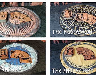 May include: Four different circular mats with various designs and symbols, each with a stack of wooden cards featuring illustrations of people and animals. The mats are labeled "The PGM", "The Pergamon", "The Dendera", and "The Phylactery".