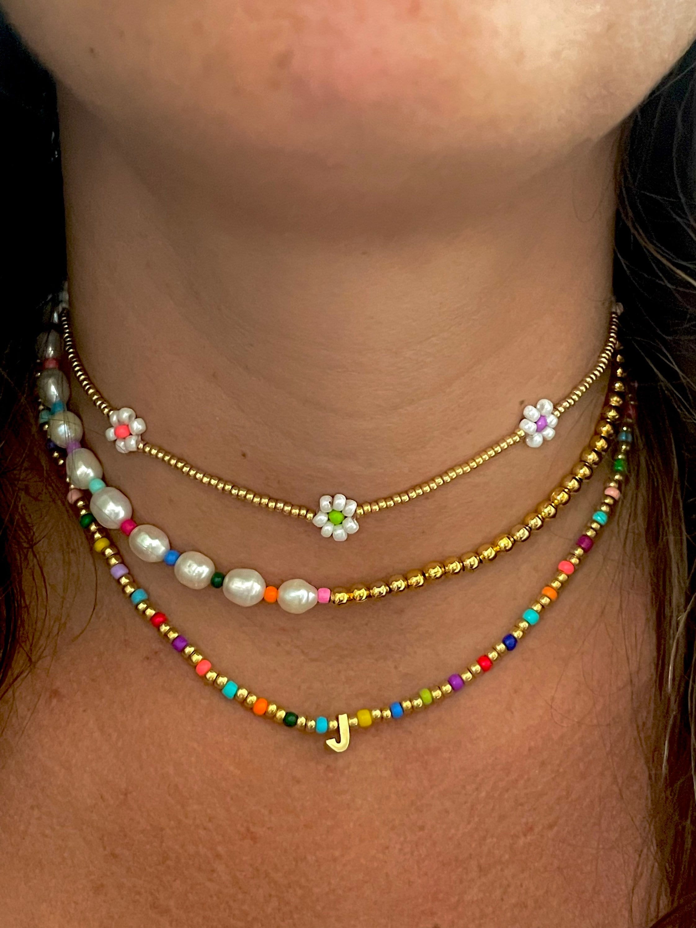 Assorted beaded necklaces in various colors and designs