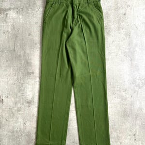 May include: A pair of green pants with a straight leg and a cuffed hem.