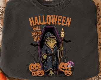 Halloween nigdy nie umrze, koszulka z żabą na Halloween, upiorny klimat sezonu, słodka, zuchwała żaba png, czarownicza żaba halloweenowa png, zabawna koszulka na Halloween