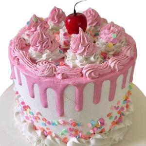 Yummy looking fake Vanilla cake with sprinkles. Fake display cake. Buttercream cake. Food prop. Birthday cake