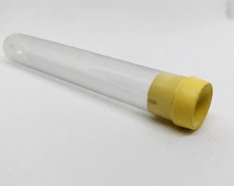 May include: A clear plastic test tube with a yellow cap. The tube is empty and has a smooth surface.