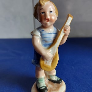 Wagner & Apel-~Porcelain figure-~Porcelain sculpture of a little musician-~