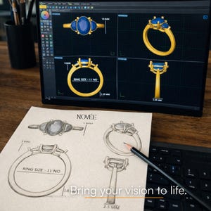 May include: A computer screen shows a 3D design of a gold ring with blue gemstones. A sketch of the ring is on paper, with the text "RING SIZE - 11 NO" and "Bring your vision to life."
