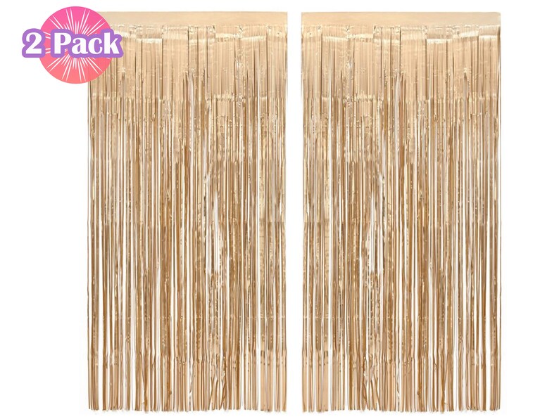 May include: Two gold foil fringe curtains, each measuring approximately 3 feet wide by 8 feet long. The curtains are made of thin strips of foil that hang from a string. The curtains are perfect for adding a touch of glamour to any party or event.