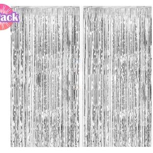 May include: Two silver foil fringe curtains, each measuring approximately 3 feet wide by 8 feet long. The curtains are made of thin strips of foil that hang down from a horizontal rod. The foil is shiny and reflective, and the curtains are perfect for adding a touch of glamour to any party or event.