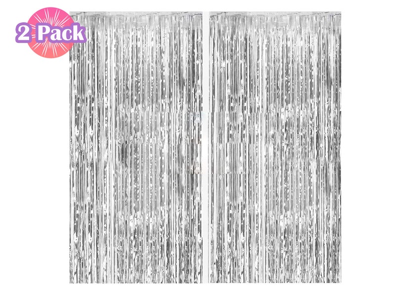 May include: Two silver foil fringe curtains, each measuring approximately 3 feet wide by 8 feet long. The curtains are made of thin strips of foil that hang down from a horizontal rod. The foil is shiny and reflective, and the curtains are perfect for adding a touch of glamour to any party or event.