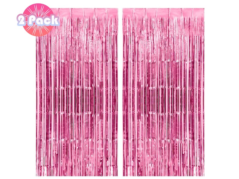 May include: Two packs of pink metallic foil fringe curtains. Each curtain is made of thin strips of foil that hang down to create a shimmering effect.