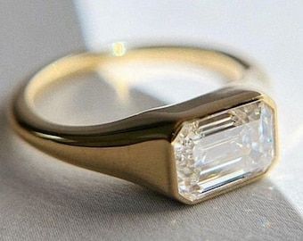 Bezel Set Emerald Cut Moissanite Ring: 14k Gold East-West Solitaire