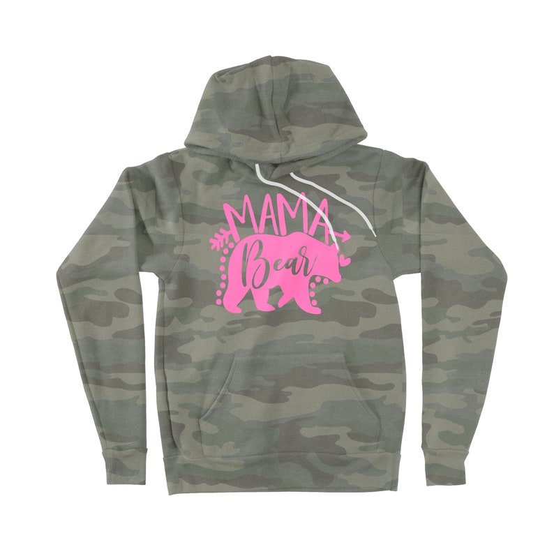 May include: A camouflage green hoodie with a pink graphic that says "Mama Bear" with a pink bear silhouette and arrows.