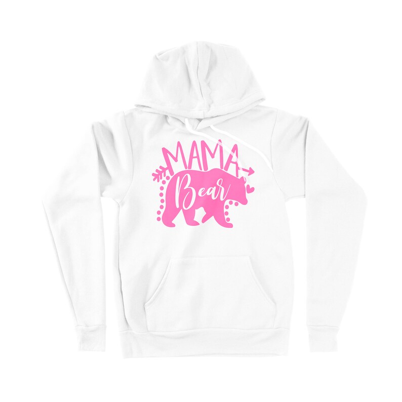 May include: White hooded sweatshirt with a pink graphic of a bear with the text "Mama Bear" and arrows on either side.