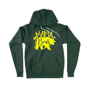 May include: A dark green hooded sweatshirt with a yellow bear and the text "Mama Bear" printed on the front.