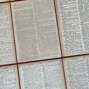 May include: Close-up of a dictionary page with the word "Valence" defined. The page is printed in black and white on a textured paper. The definition explains the degree of combining power of an atom.