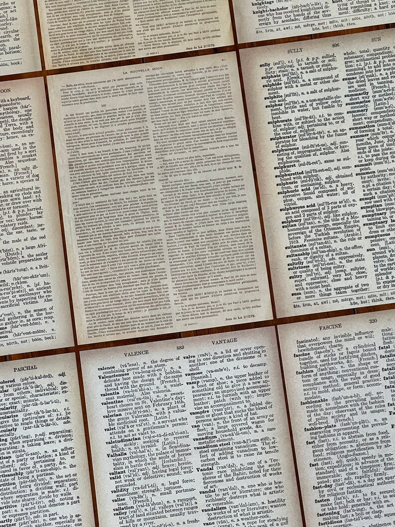 May include: Close-up of a dictionary page with the word "Valence" defined. The page is printed in black and white on a textured paper. The definition explains the degree of combining power of an atom.