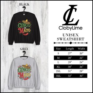 May include: A unisex sweatshirt with a black and grey color option. The front of the sweatshirt features a graphic design of a sombrero with the text "Cinco de Mayo". The size chart is included with measurements in inches.