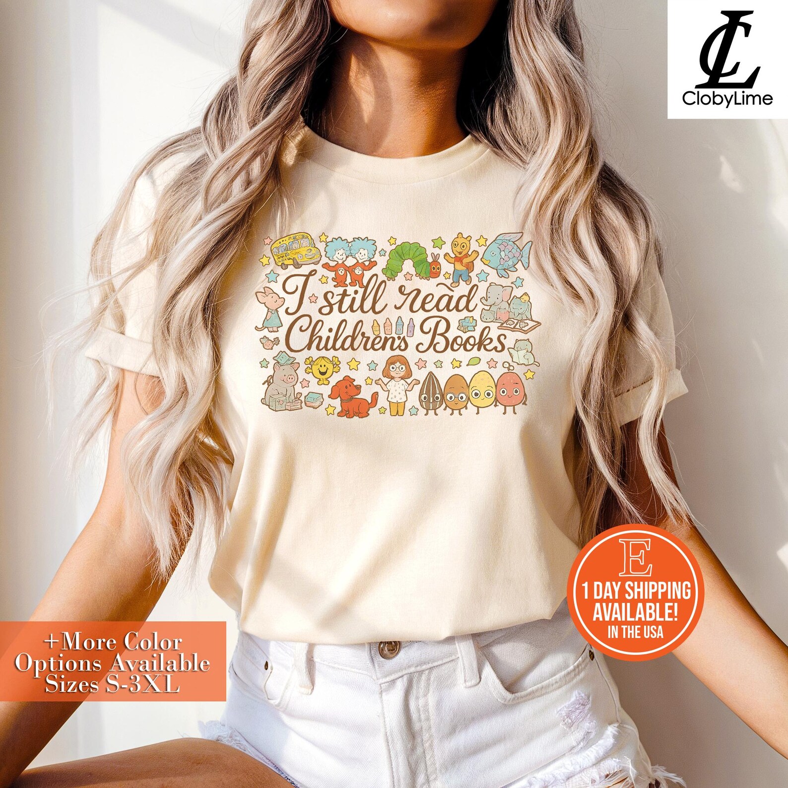 A woman wearing a soft ivory t-shirt featuring the playful phrase “I still read Children’s Books” in a whimsical brown script. Surrounding the text are colorful, cartoon-style illustrations of iconic children's book characters such as the Very Hungry Caterpillar, the Pigeon from Mo Willems' books, Pete the Cat, Elephant & Piggie, a fish, crayons, a school bus, and other adorable animals and objects. The overall style is bright, nostalgic, and charming. The woman pairs the tee with white high-waisted shorts, and her long, wavy, blonde-highlighted hair cascades over her shoulders.