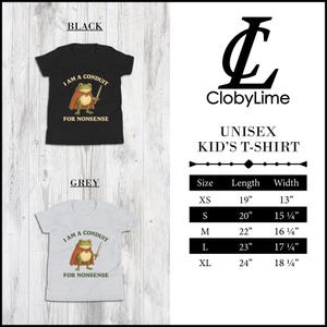May include: Black and grey unisex kid's t-shirts with a cartoon frog wearing a cape and holding a sword. The text on the shirt reads "I AM A CONDUIT FOR NONSENSE". The shirts are available in sizes XS to XL.