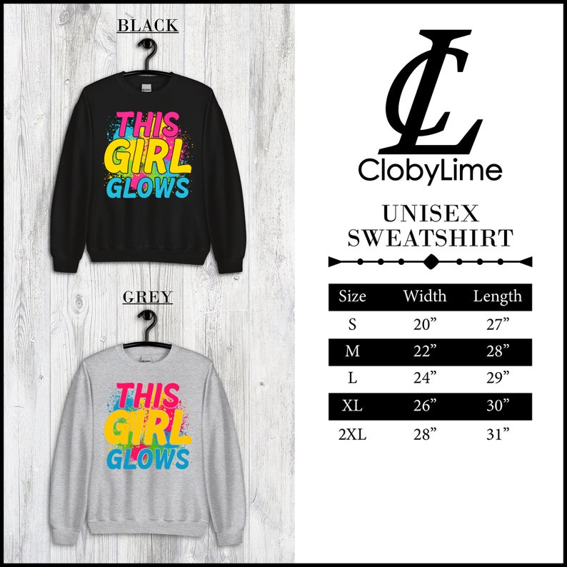 Puede incluir: Sudadera unisex con el texto "This Girl Glows" en letras de colores sobre un fondo negro y gris. La sudadera est&aacute; disponible en tallas S, M, L, XL y 2XL. La tabla de tallas muestra el ancho y la longitud de cada talla en pulgadas.