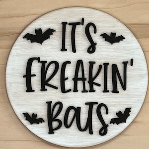 You choose! It’s freaking bats wooden wall hanging.