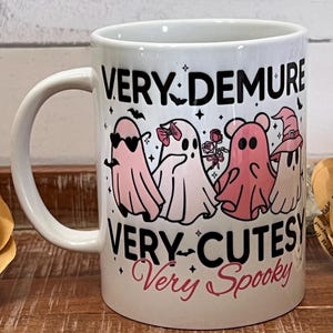 Demure cutesy and spooky ghost Mug.