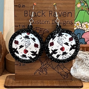 Glitter plague doctor crow earrings.
