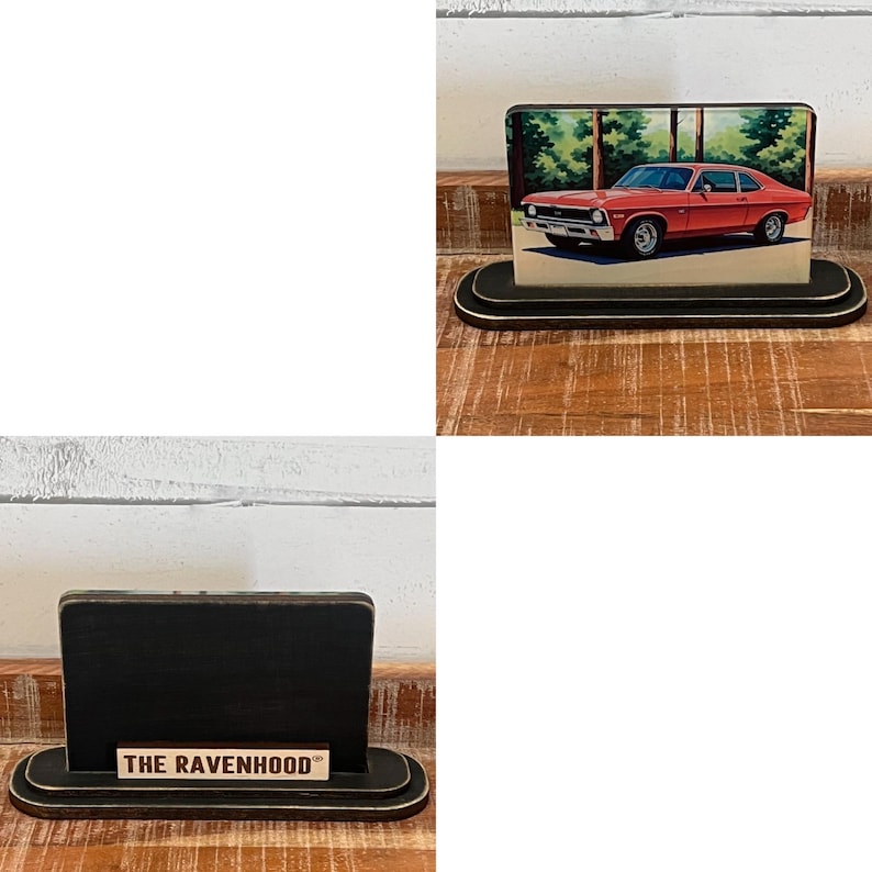May include: A black wooden desk organizer with a rounded base and a rectangular back. The organizer features a printed image of a red car. The text "THE RAVENHOOD" is printed on the base.