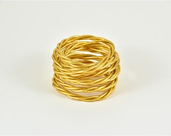 Gold twisted Buddhist bangle