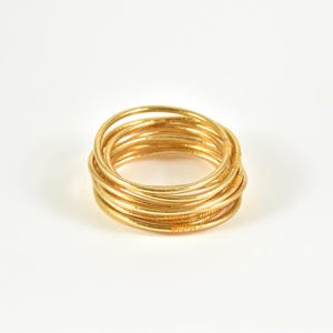 Bracciale buddista in oro chiaro