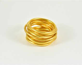 Thick gold Buddhist bangle