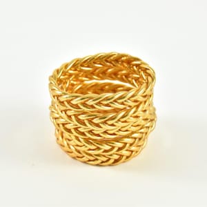 Gevlochten gouden boeddhistische armband