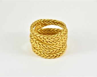 Gold braided Buddhist bangle