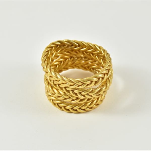 Brazalete budista trenzado en oro claro