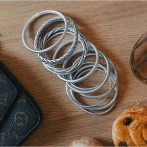 Silver twisted Buddhist bangle image 3