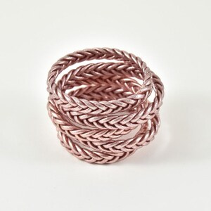 Bracciale buddista intrecciato in oro rosa