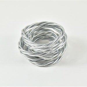 Shiny silver twisted Buddhist bangle image 1