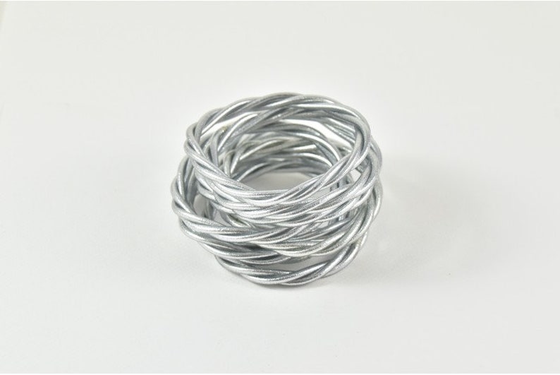 Shiny silver twisted Buddhist bangle image 1