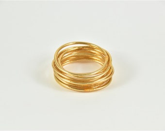 Fine light gold Buddhist bangle