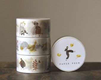 May include: A stack of three rolls of white washi tape and one individual roll standing upright. The tape features illustrations of figures in brown clothing, yellow ginkgo leaves, and botanical elements. The label reads PAPER POEM.
