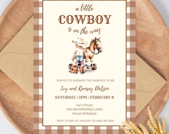 May include: A brown and white gingham pattern background with a white card. The card has a watercolour illustration of a cowboy riding a rocking horse. The text on the card reads "a little COWBOY is on the way". The card also includes the text "Join us to shower the parents to be Ivy and Ramsey Dietzen Saturday | 2PM | February 8 Ivy's House 394 Whispering Lane, Palm Springs RSVP to Amy by January 20 (898) 383-0090".
