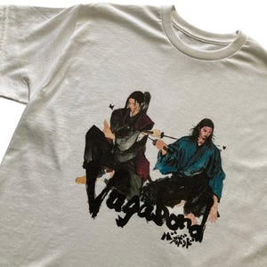 MAGLIETTA UNISEX "Vagabond" di Sasaki Kojiro e Musashi Miyamoto (scegli la maglietta che preferisci!)